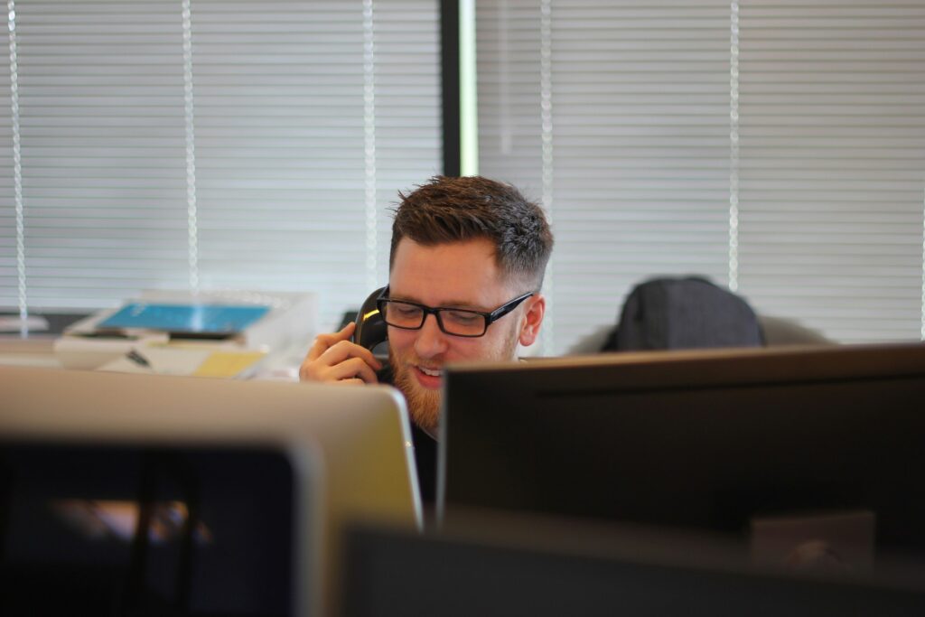 Office employee working comfortably after commercial window tinting installation in NJ
