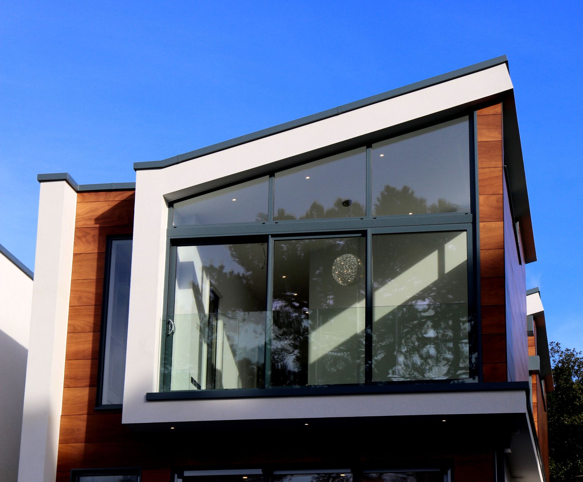 Modern home exterior with large windows ready for home window tinting in Old Bridge NJ