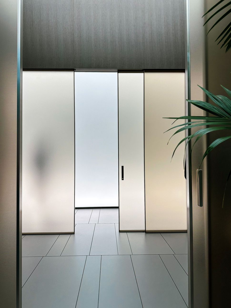 Frosted privacy glass film installed on sliding doors in a New Jersey home
